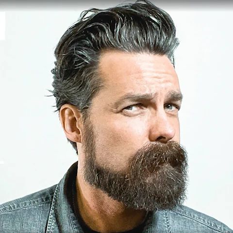 A long and low beard style with clean-shaven upper cheeks